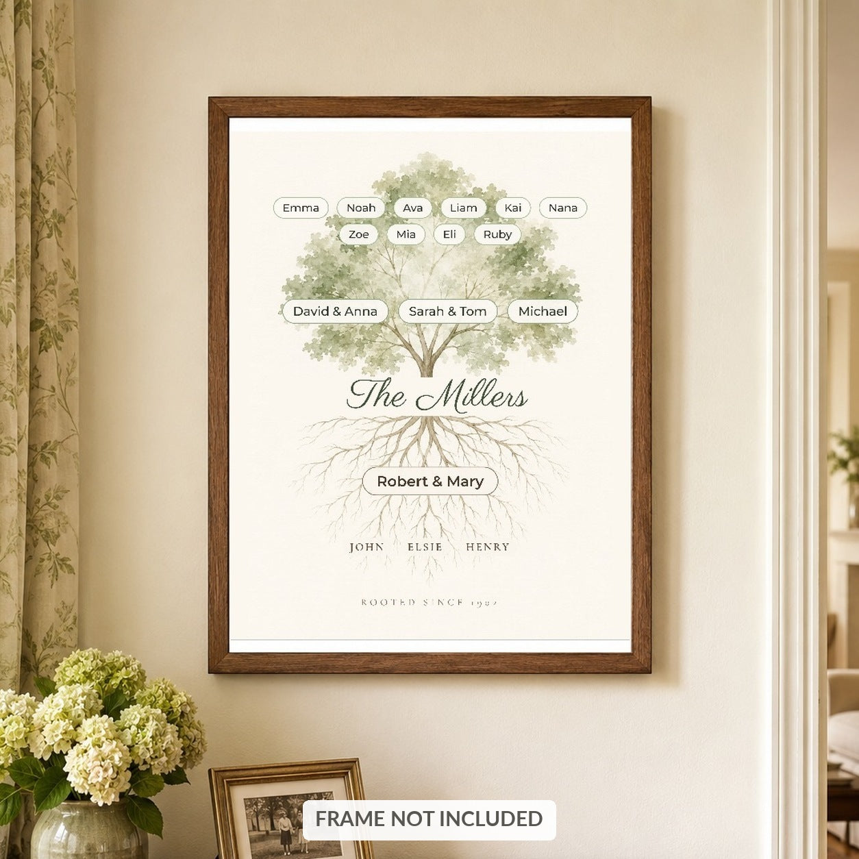 Family tree print with ancestors in the roots, hanging in a walnut frame above a sideboard, frame not included
