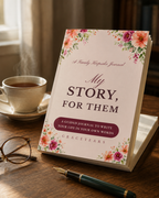 The My Story, For Them journal on a table beside a cup of tea, reading glasses and a fountain pen