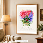 Framed birth flower family print above a living room armchair, frame not included