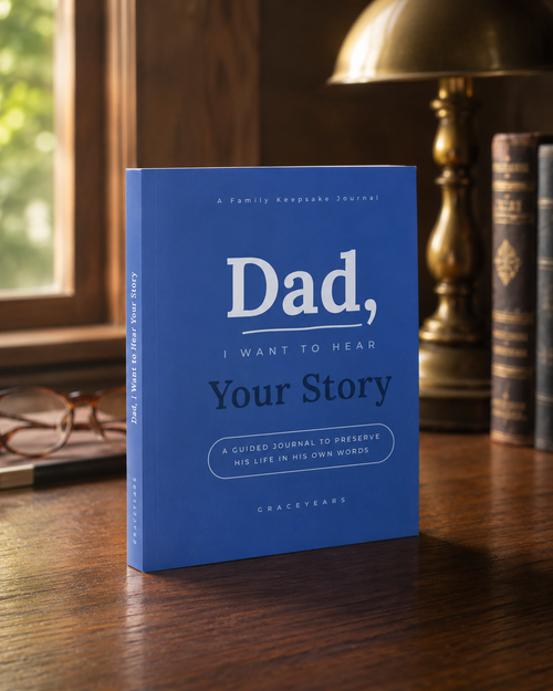 Dad, I Want to Hear Your Story guided journal standing on a walnut desk in warm window light