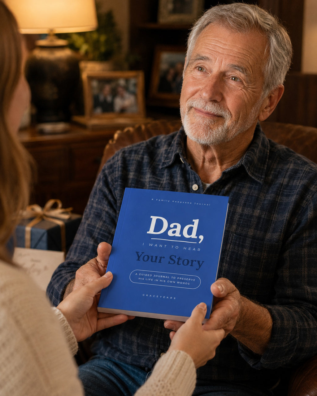 Adult daughter giving the Dad, I Want to Hear Your Story journal to her father as a gift