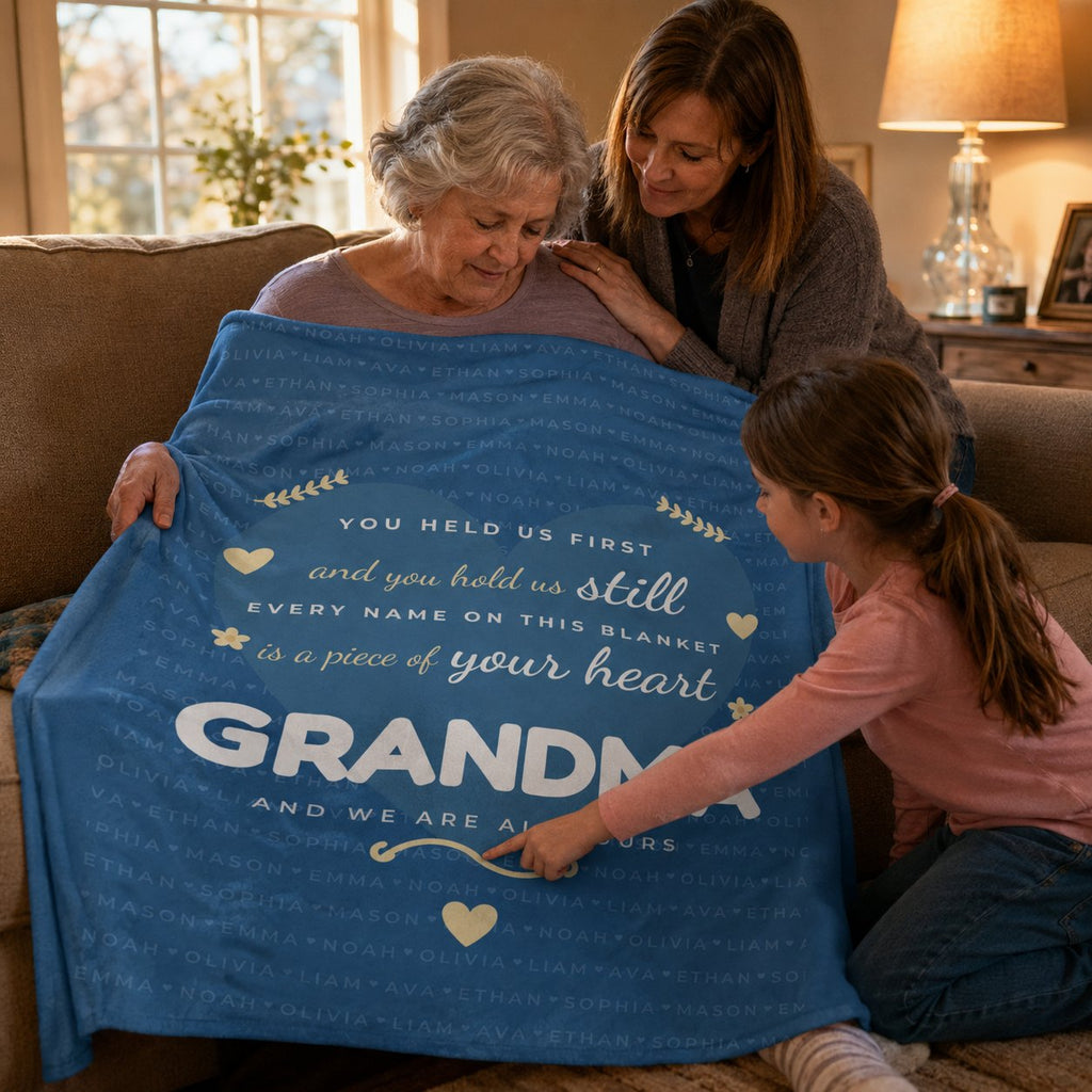 Three generations looking together at the personalized names blanket