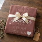 Personalized grandkids names blanket folded and tied with a cream ribbon as a gift